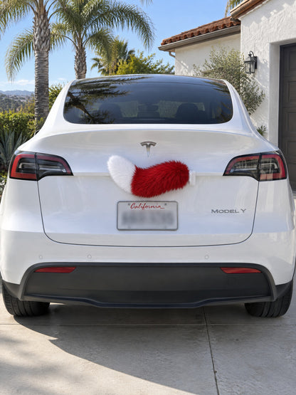 Red & White | Wagride tail mounted at the rear of a parked car