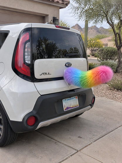 Rainbow | Wagride tail mounted at the rear of a parked car